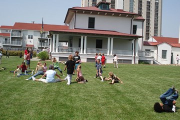 Children playing on grounds of the Absecon Lighthouse.