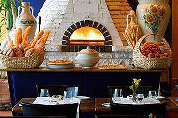 Brick Oven visible with table seating at Girasole in Atlantic City