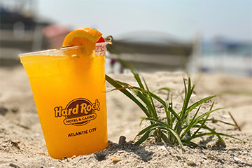 Orange Crush Cocktail in Sand on Atlantic City Beach