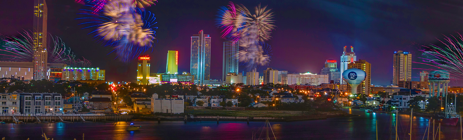 Fireworks Atlantic City Skyline at night overlooking Gardner's Basin. DO AC water tower in view. 