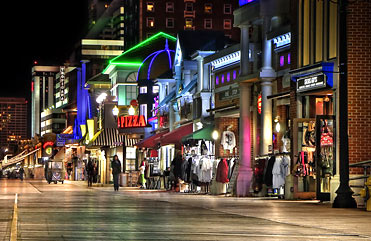Boardwalk shops at night in Atlantic City.