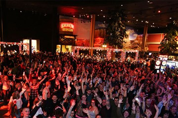 Wild Wild West Caesars Atlantic City crowds with hand in air