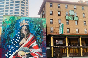 The Irish Pub Atlantic City stands next to a beautiful mural that contains Ms. America with American flag and historic Atlantic City nostalgia.