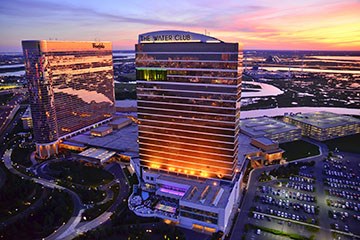 Borgata Hotel, Casino & Spa at sunset with surrounding bays in view.