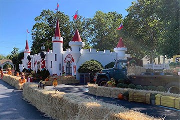 Storybook Land front entrance with haybales and fall decor.
