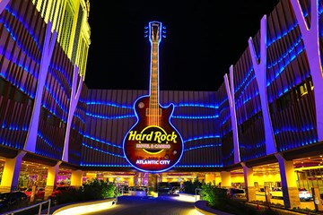Hard Rock Guitar Sign at night entrance.