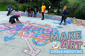 Make Art Chalk about AC - Artist creating a chalk drawing at a park in Atlantic City.