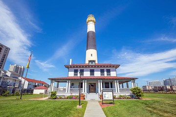 Absecon Lighthouse against blue skies in Atlantic City, NJ.