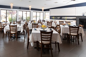 Johnny's Cafe Ventnor - Interior dining room with elegant contemporary feel large windows and fireplace.