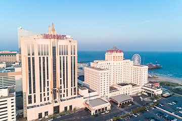 View of Resorts Casino Resort in Atlantic City. Beach and Steel Pier in background.